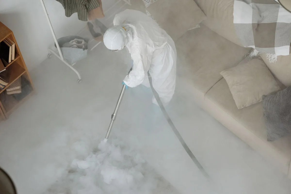 Biohazard cleanup technician in protective equipment, Arkadelphia, AR